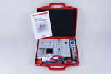 The picture shows a red case containing an experiment kit for basic electrical circuits. In addition to various components and circuits, there is a manual that provides instructions and support for conducting experiments.