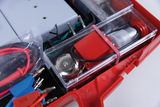 The picture shows a practical box equipped with various experimental materials, including cables, contacts and a mechanism. These materials are designed for use in education to enable students to learn experimentally.