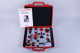 The picture shows a red suitcase with various models and components for gear and drive experiments. There is also a manual next to it, which probably contains instructions for using the parts.