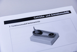 The picture shows a functional model of a chain drive mounted on a platform. It is used as a teaching material in the context of transmissions and drive systems.