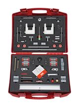 The picture shows a red toolbox containing various experimental materials. Inside are various components such as brackets, rods and accessories for experimental applications in school education.