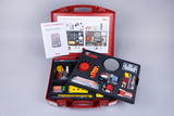 The picture shows a red experiment box for elementary physics, which is open and lying on a gray background. Various teaching materials and utensils for carrying out physics experiments are clearly arranged in the case.