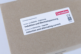 The picture shows a brown package with a label from the company Cornelsen. The contents of the student set deal with electricity, especially induction and alternating current, and serves as an extension for experimental purposes in education.