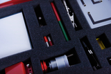 The picture shows a well-sorted set of experimental materials arranged in a foam tray. Various tools and materials can be seen, including pins, clamps and other accessories for experimental purposes.