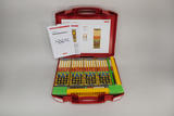 The picture shows a molecule construction kit in a red case that contains various building blocks in different colors to represent molecules. There is also a manual and worksheets that provide instructions for experiments.