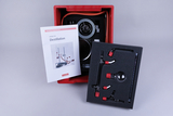 The picture shows a student distillation kit housed in a red case. It includes various glass parts and instructions describing how to use this experimental equipment.