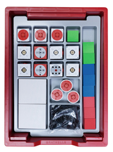 The picture shows a sorting system with different components in a box intended for experimental purposes in the educational field. It contains red, green, blue and grey elements that can probably be used for different learning activities and experiments.