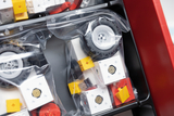 The image shows a collection of components in transparent packaging intended for experimentation needs in an educational context. The parts include wheels and various colored blocks that can be used for building and conducting experiments.