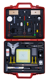 The picture shows a red toolbox filled with various experimental materials. The box contains measuring instruments, chemicals, glasses and various utensils that can be used for scientific experiments.
