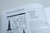The document describes materials for building a beam balance, including required parts such as balance columns, balance beams, and balance pans. It also provides instructions for conducting a classroom experiment that encourages teamwork.