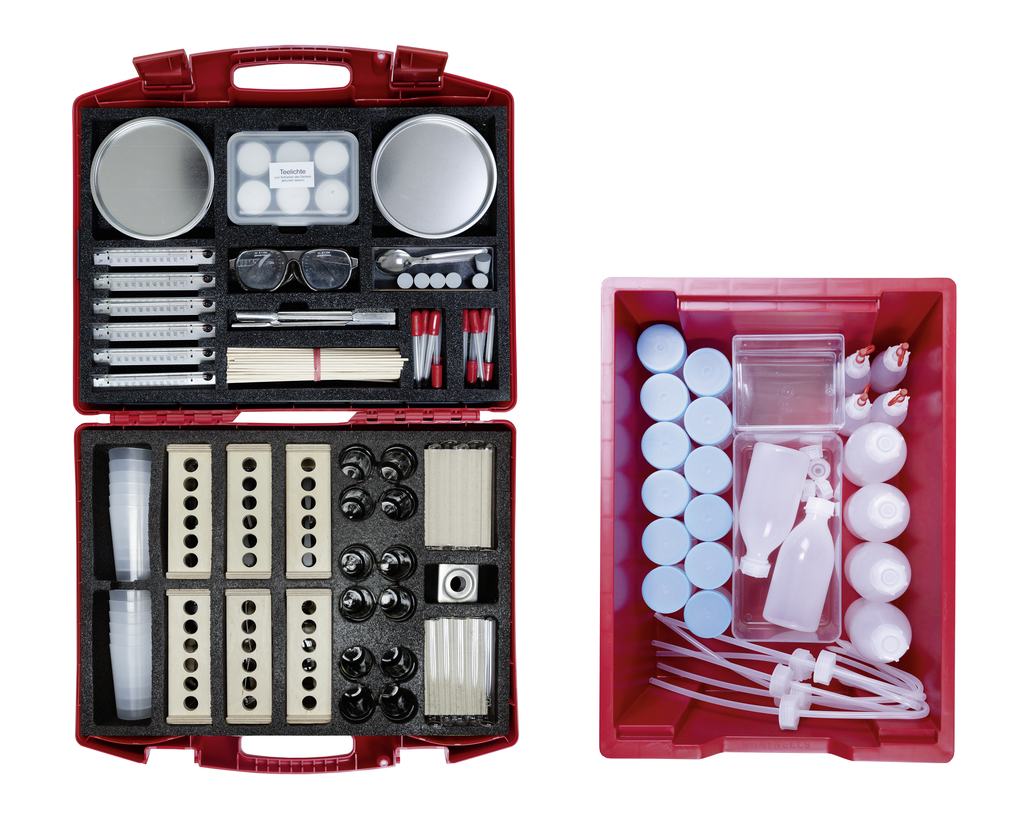 An experiment kit provides a variety of materials such as measuring instruments, beakers, pipettes, and safety goggles that can be used for scientific experiments in educational settings. It consists of a red carrying case and a separate box containing additional components, making it ideal for students and teachers.